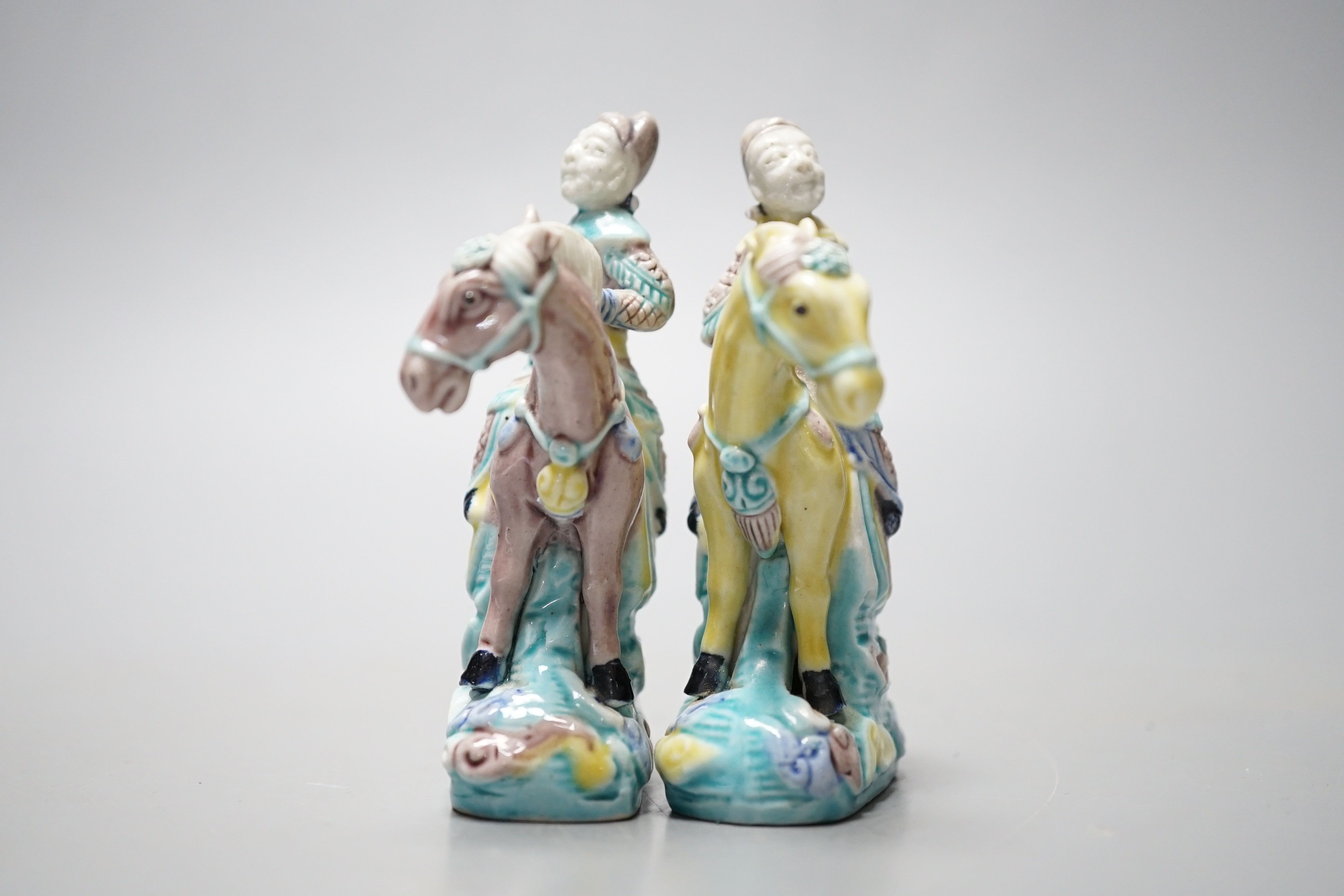 A pair of early 20th century Chinese equestrian groups, 9cm tall
